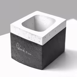 a stone block that has a handle to hold it