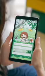 a woman is playing on a mobile phone