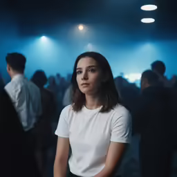 a woman is standing in front of a dark background