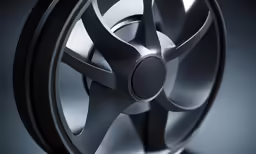 a vehicle wheel with spokes and an extra center piece is shown