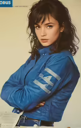 a magazine with an image of a woman in a blue leather jacket