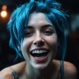 a young woman with blue hair has bright blue hair