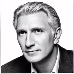 a close up of a person wearing a suit and tie