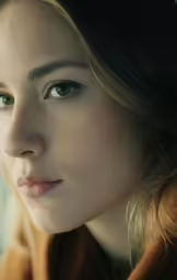 a close up image of a woman wearing a jacket