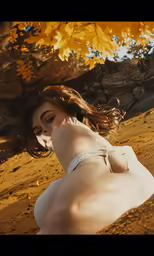 an image of a woman lying on the ground under a tree