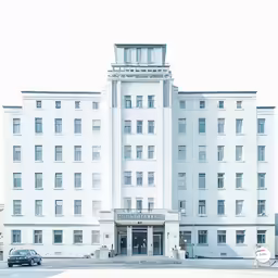 a white building on the corner of a street