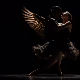 a woman is performing a dance with large wings