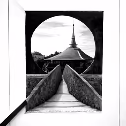 black and white photo of stairs leading up towards a clock tower