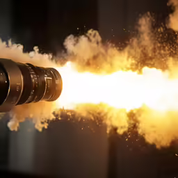 a camera on fire with smoke coming out