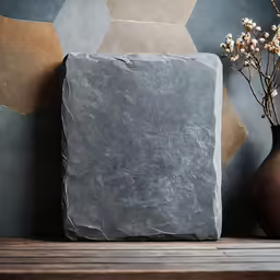 grey slate block sitting on a wooden surface