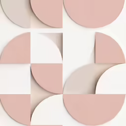 pink, cream and grey circular shapes on a white surface