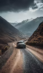 the back end of a black car on the road