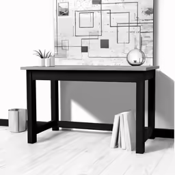 a large art piece is behind the wooden table
