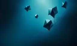 three umbrellas floating in the ocean on blue water