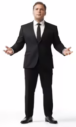 a man in a black suit with his hands out