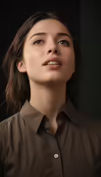 a young lady posing for a studio shoot wearing a brown shirt