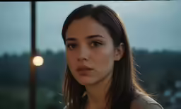 a girl looking ahead in the background