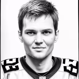 a person with a short haircut in front of a white background