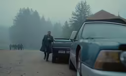 an image of a man and car in the fog