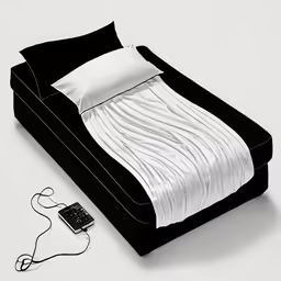 a bed with a phone next to it on top of a table