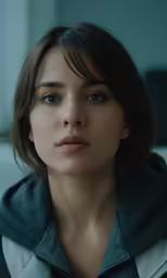 a young woman with dark hair in the background