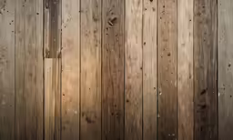 a wood fence made with thick planks