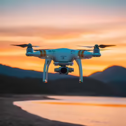 a white flying over the ocean in front of a sunset