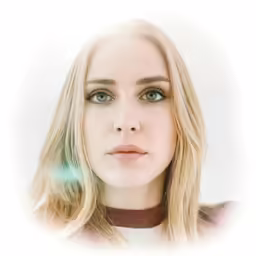 a woman with blonde hair and blue eyes looking at the camera
