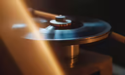 a turntable with one knob and the other with a cord attached