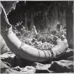 a person on a field with plants in their hand