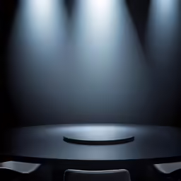 a large table with chairs and spotlights above it