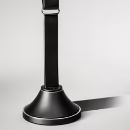 an apple watch on top of a metal display stand
