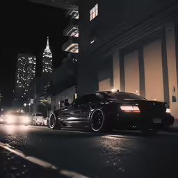 a black car is shown on a city street at night