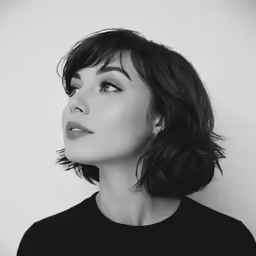 a woman with her hair in a bobbley style