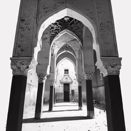 a black and white photo taken through a archway