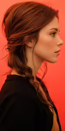 a young lady with red hair and a braid
