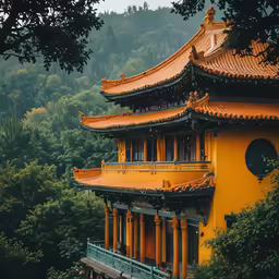 a pagoda on top of a mountain surrounded by trees