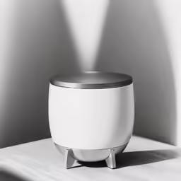 light coming in from a long, straight beam coming through a hole between a round planter