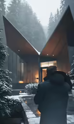 a man takes pictures of a snowy scene outside a cabin