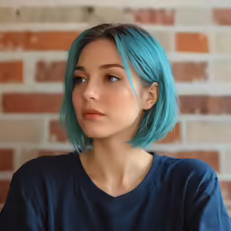 a girl with blue hair and an orange