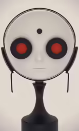 a white sculpture with two red eyes and one black stand