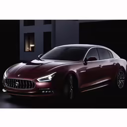 a maroon sports car parked in front of a building