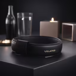 a pair of black and brown candles on a table
