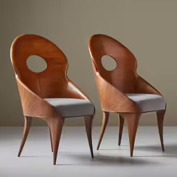 two chairs in the middle of a gray surface