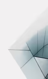 the corner of a white wall with lots of squares
