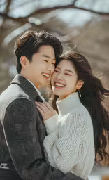 two people standing next to each other and smiling,a beautiful young asian couple with a smile on their face