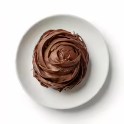 a plate with a chocolate frosted pastry on top