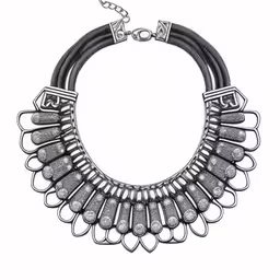 the statement necklace features a metal chain and small beadings,a silver and black necklace on a white background,a black and silver necklace with silver beads on a white background,a black necklace on a silver chain,a silver necklace with metal accents and chain on it