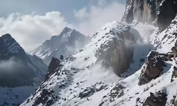 a couple of mountains with snow on them