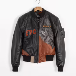 a leather jacket hanging on the wall